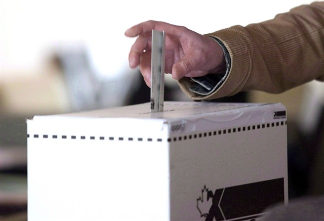 A man casts his vote for the 2011 federal election in Toronto in this May 2, 2011 photo. Newly released court documents describe how a junior Conservative staffer in Guelph, Ont., charged with elections offences bragged about his allegedly fraudulent exploits to other young partisans.THE CANADIAN PRESS/Chris Young.