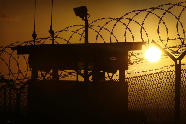 In this photo reviewed by the U.S. military, the sun rises above Camp Delta at Guantanamo Bay Naval Base, Cuba, Wednesday, Nov. 20, 2013. 