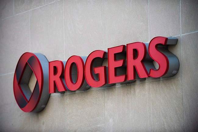 The Rogers Communications sign is marks tThe Rogers Communications sign is marks the company's headquarters in Toronto, April 25, 2012.