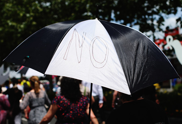 Protesters march to stop violence against women on November 25, 2013 in Auckland, New Zealand. (Photo credit: Getty Images)
