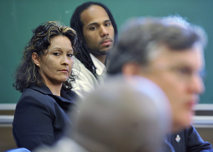 ilian Villanueva, mother of Fredy Villanueva, and Will Prosper, a Montreal north community activist, centre, listen to lawyer, Alain Arsenault, speak at a press conference in Montreal, Tuesday, May 26, 2009