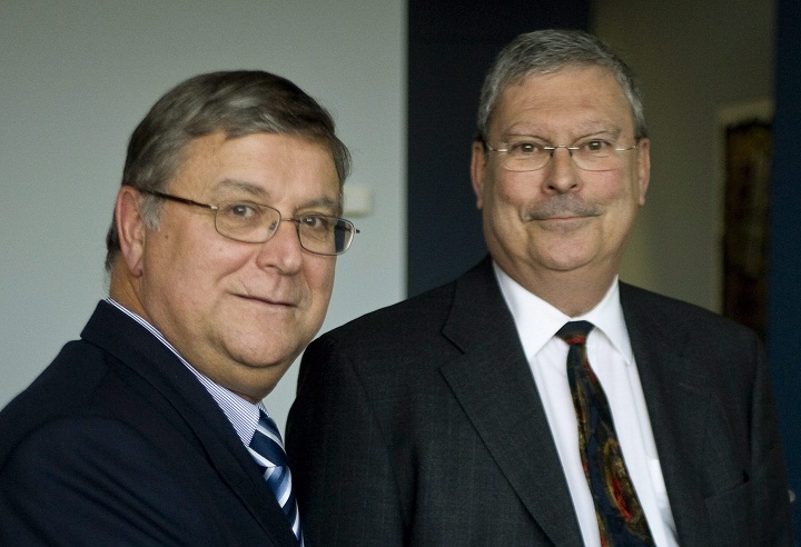 Quebec judge Robert Sansfacon, right, who will preside of the public inquiry into the shooting of Fredy Villanueva by a Montreal police officer, and prosecutor Francois Daviault pose for a photograph Wednesday, Dec. 3, 2008 in Montreal.