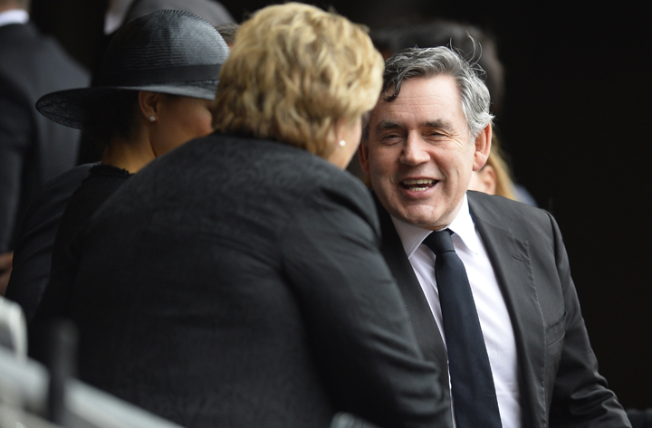 Forme Prime Minister Gordon Brown arrives for the memorial service of South African former president Nelson Mandela at the FNB Stadium (Soccer City) in Johannesburg on December 10, 2013. (Photo credit: Getty Images)