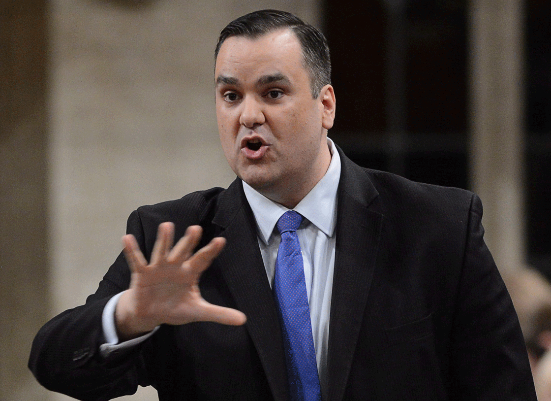 Industry Minister James Moore is imposing new rules on big wireless carriers aimed at bolstering competition.