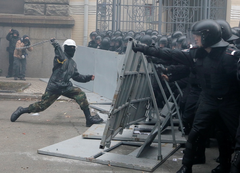 Protesters clash with police outside the presidential office in Kiev, Ukraine, on Sunday, Dec. 1, 2013.
