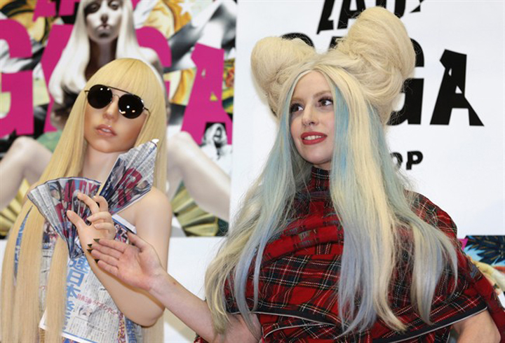 Lady Gaga poses for photographers with her life-sized doll during a press conference to promote ARTPOP in Tokyo on Sunday.