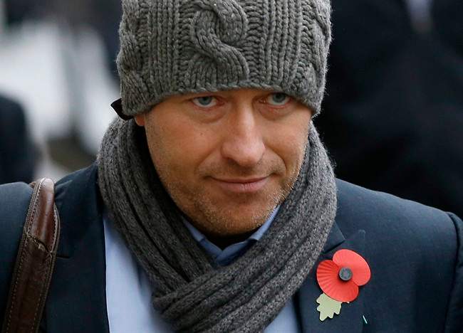 In this Thursday, Oct. 31, 2013 file photo, former News of The World news editor Ian Edmondson arrives at The Old Bailey law court in London.