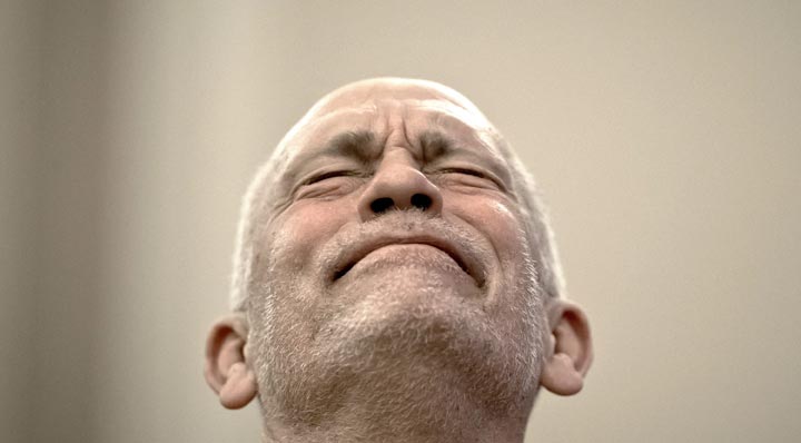 John Malkovich grimaces during a press conference in Bucharest, Romania. (AP Photo/Vadim Ghirda)