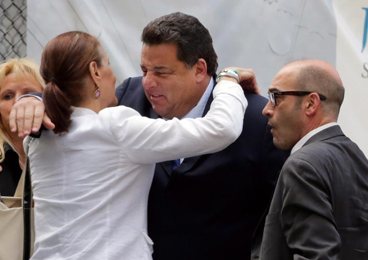 Actors Steve Schirripa, centre, and John Ventimiglia arrive for the funeral service of James Gandolfini, star of “The Sopranos,” in New York. (AP Photo/Richard Drew)