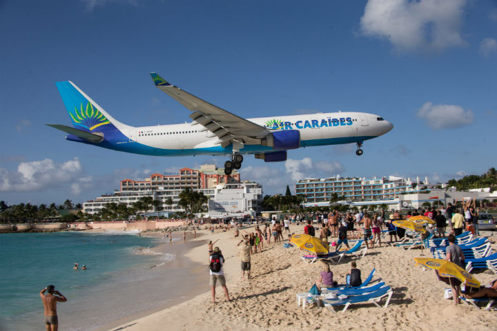 Planes approaching the Princess Juliana International Airport of Sint Maarten, constituent country of the Kingdom of the Netherlands, Caribbean.