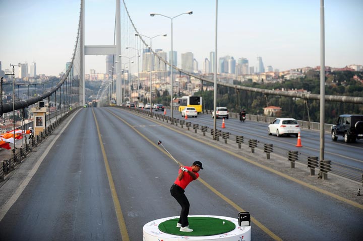 Tiger Woods hits a golf ball during an event to promote Turkish Airlines Open golf tournament in Istanbul on November 5, 2013. (Bulent Kilic/AFP/Getty Images)