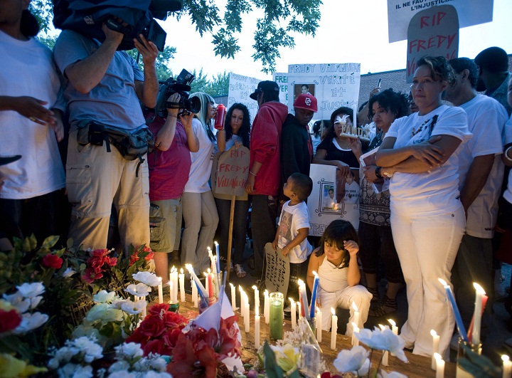 Lilian Villanueva, mother of Fredy Villanueva, attends a vigil at at the site where her son was killed on the first anniversary of his death in Montreal, Sunday, August 9, 2009. A