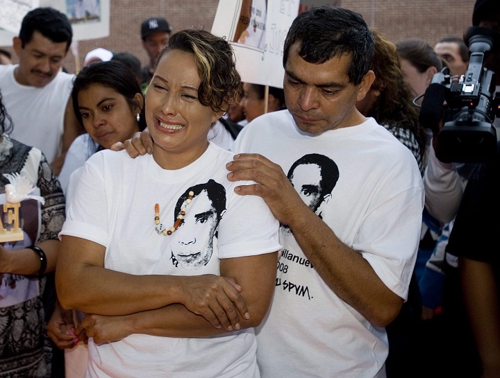 Gilberto and Lilian Villanueva, parents of Fredy Villanueva, attend a vigil at at the site where their son was killed on the first anniversary of his death in Montreal, Sunday, August 9, 2009.