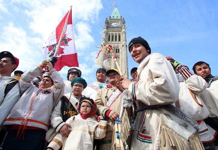 A group of young aboriginal people who travelled 1,600 kilometre on foot from the James Bay Cree community of Whapmagoostui, Quebec celebrate their arrival on Parliament hill in Ottawa, Monday, March 25, 2013.