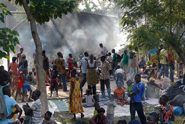 Internally displaced people gather in the Don Bosco Center outside Banghi, Central African Republic, Saturday Dec. 7, 2013, fearing reprisal attacks from the Muslim ex-rebels who control Central African Republic. 
