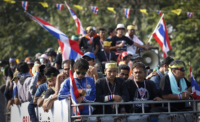 Anti-government protesters leave Democracy Monument to join other protesters in different locations in Bangkok, Thailand, Sunday, Dec. 8, 2013. 