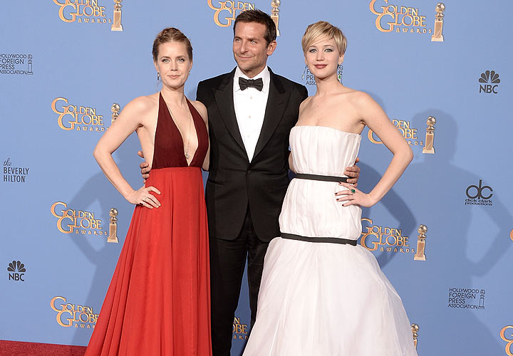 (L-R) Actors Amy Adams, Bradley Cooper and Jennifer Lawrence, winners of Best Motion Picture – Musical or Comedy for ‘American Hustle,’ pose in the press room during the 71st Annual Golden Globe Awards held at The Beverly Hilton Hotel on January 12, 2014 in Beverly Hills, California. (Photo by Kevin Winter/Getty Images)