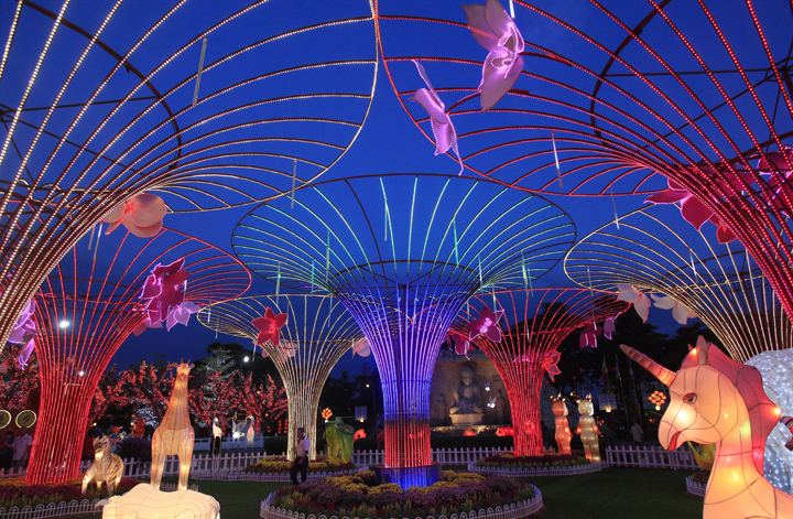 A man walks at Fo Guang Shan Dong Zen Buddhist Temple decorated for the Chinese New Year in Jenjarom, outside Kuala Lumpur, Malaysia, Wednesday, Jan. 29, 2014. (Photo credit: Lai Seng Sin/AP Photo)