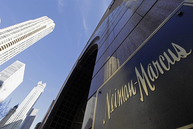 FILE - In this Wednesday, March 11, 2009 file photo, the Chicago skyline is reflected in the exterior of Neiman Marcus on Michigan Avenue in Chicago. 