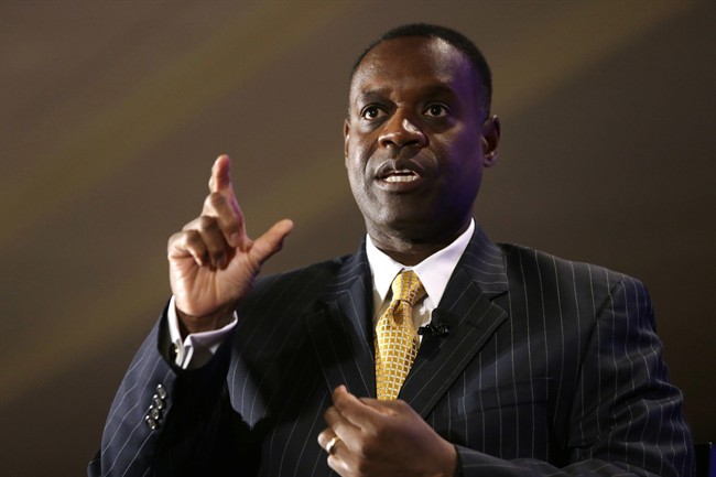  This Oct. 3, 2013, file photo shows Detroit Emergency Manager Kevyn Orr gesturing during an interview at the Detroit Economic Club luncheon in Detroit.
