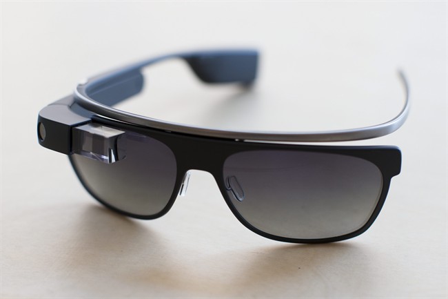 The new Google Glass "Classic" sunglass frames in "charcoal" color rests on a table at the Google Glass Basecamp space at Chelsea Market, Friday, Jan. 24, 2014, in New York.