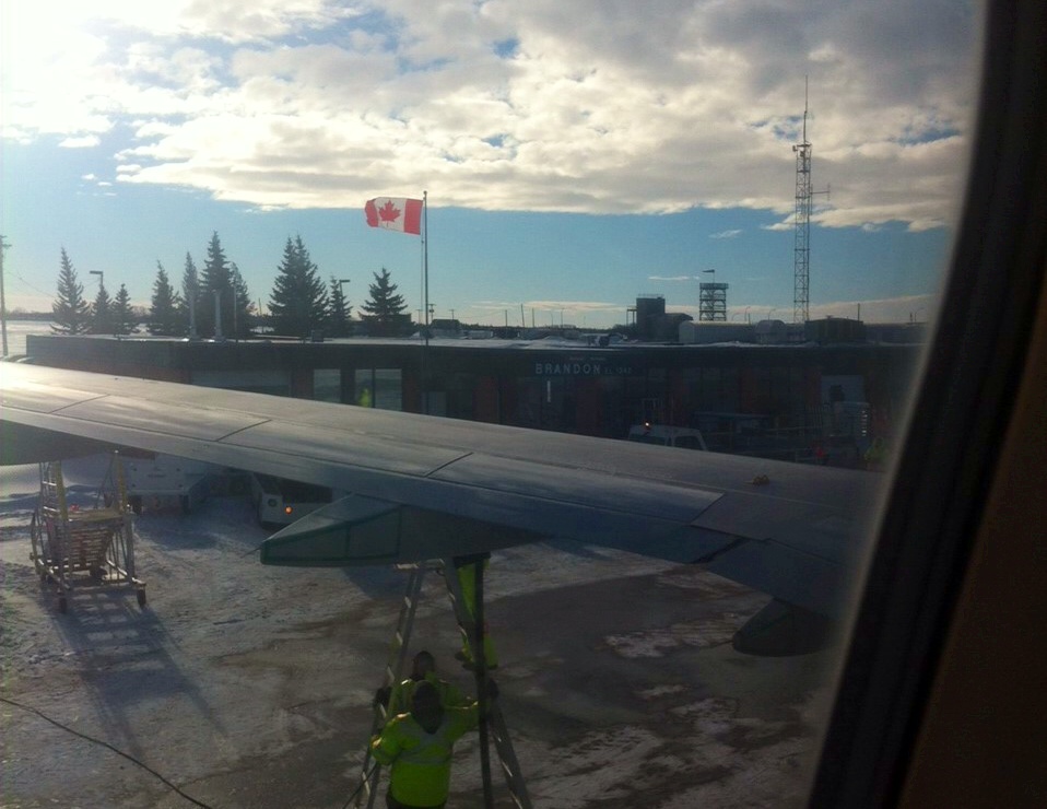 A passenger’s view from inside an Air Canada flight diverted to Brandon Manitoba due to bad weather in Winnipeg on Wednesday, Jan. 15, 2014 were also smaller aircraft belonging to Calm Air and Perimeter Aviation.