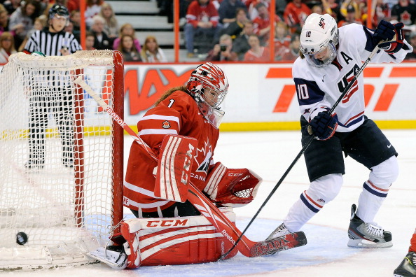 Meghan Duggan #10 of Team USA deflects the puck wide on Shannon Szabados #1 of Team Canada during the IIHF Womens World Championship Gold Medal Game at Scotiabank Place on April 9, 2013 in Ottawa.