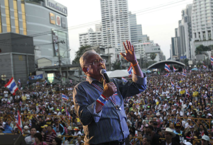Anti-government protest leader Suthep Thaugsuban speaks to his supporters Monday, Jan. 13, 2014, in Bangkok, Thailand.