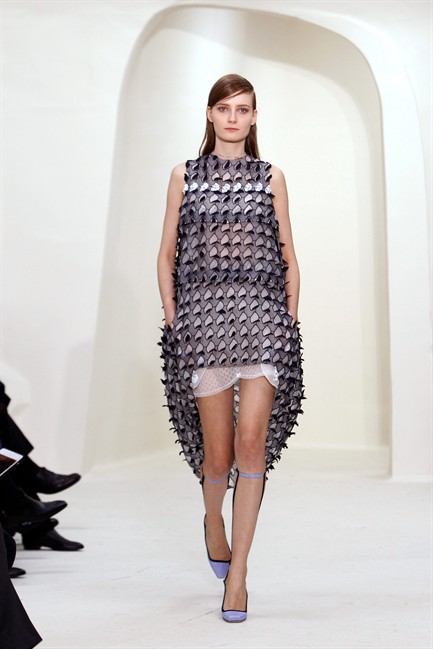 A model presents a creation as part of the Dior Spring-Summer 2014 Haute Couture fashion collection, presented Monday, Jan. 20, 2014 in Paris.