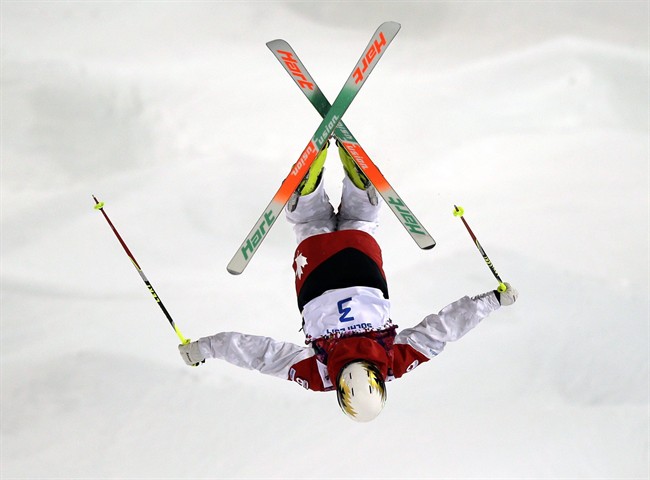 Canada's Chloe Dufour-Lapointe jumps during qualifying in the women's moguls at the Rosa Kutor Exreme Park ahead of the 2014 Winter Olympics, Thursday, Feb. 6, 2014, in Krasnaya Polyana, Russia.