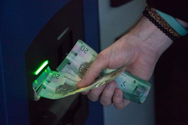 A woman was robbed at a Marion Street ATM.