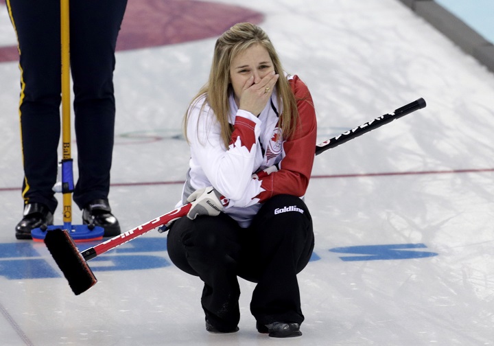 Canadas skip Jennifer Jones reacts after delivering the last rock to defeat Sweden in the women’s curling gold medal game.