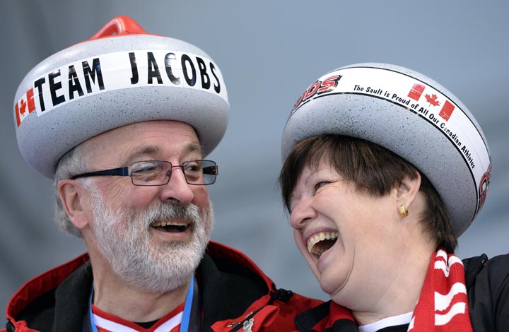 Canada’s supporters cheer during the Men’s Curling Round Robin Session 10 at the Ice Cube Curling Center during the Sochi Winter Olympics on February 16, 2014. (Andrej Isakovic/AFP/Getty Images)