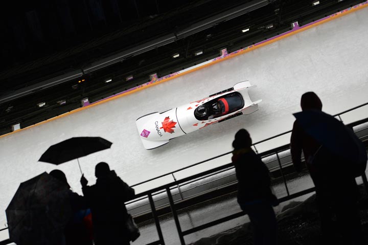 Canada-1 two-woman bobsleigh pilot Kaillie Humphries and Heather Moyse compete during the Women’s Bobsleigh Heat 2 at the Sliding Center Sanki during the Sochi Winter Olympics on February 18, 2014. (Leon Neal/AFP/Getty Images)