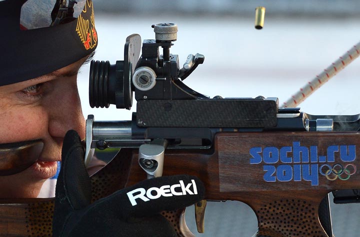Germany’s biathlete Andrea Henkel shoots at the shooting range during a training session ahead of the Sochi 2014 Winter Olympics at the Laura Cross Country Skiing and Biathlon Centre in Rosa Khutor, near Sochi, on February 6, 2014. (Alberto Pizzoli/AFP/Getty Images)