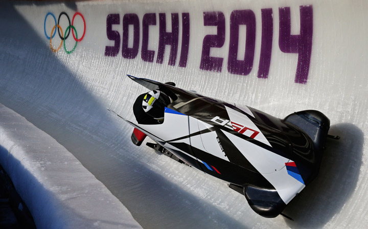 Cory Butner of United States pilots a bobsleigh practice run.