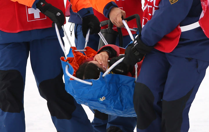 Yuki Tsubota is carried off the hill