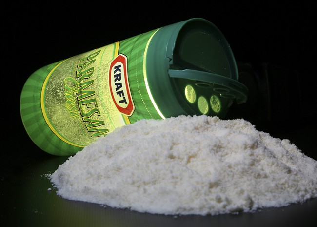 A package of Kraft parmesan cheese is seen in Washington, Tuesday, March 11, 2014. Looking for American-made parmesan cheese on the grocery aisle? If the European Union gets its way, you may not be able to find it. 