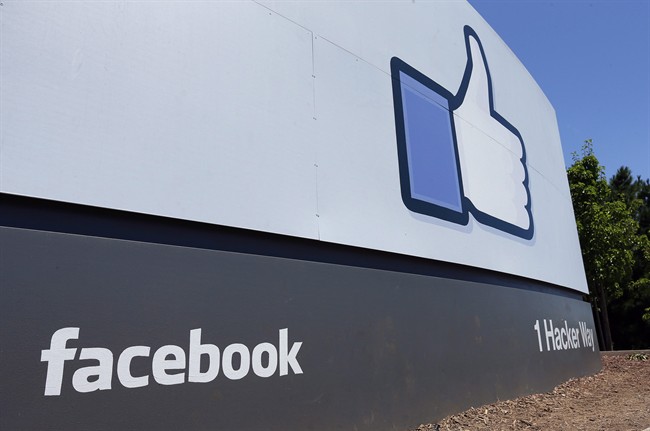 This July 16, 2013 photo shows a sign at Facebook's headquarters in Menlo Park, Calif.