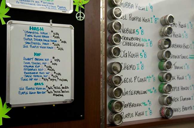 Varieties of marijuana are listed on a board that are available at The Dispensary in Vancouver, B.C. Thursday, March 6, 2014. THE CANADIAN PRESS/Jonathan Hayward.