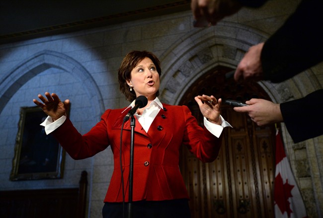 B.C. Premier Christy Clark speaks to reporters in the Foyer of the House of Commons on Parliament Hill in Ottawa on Monday, March 31, 2014. THE CANADIAN PRESS/Sean Kilpatrick.