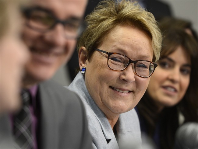 PQ leader Pauline Marois appears at a news conference during a campaign stop at a medical clinic in Laval, Que., Monday, March 17, 2014.