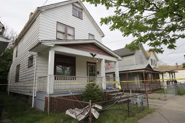 This May 7, 2013, file photo, shows a house where three women, Amanda Berry, Gina DeJesus and Michelle Knight, who went missing separately about a decade ago, escaped from captivity in Cleveland.