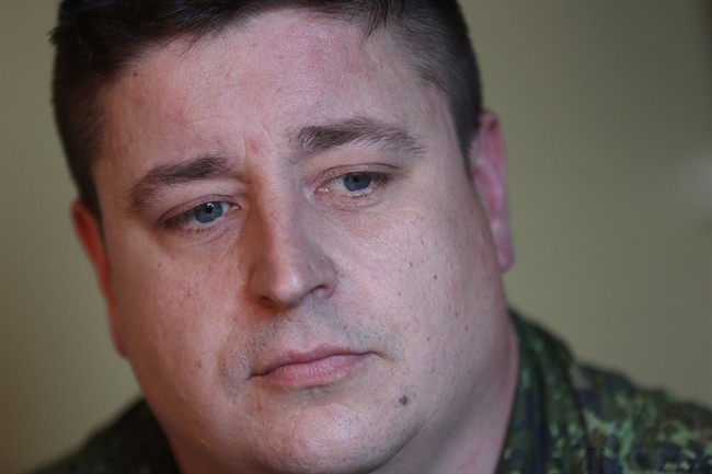 Afghanistan veteran Cpl. Jamie MacWhirter poses for a photo at home in Goulds, N.L. on Tuesday, July 30, 2013.
