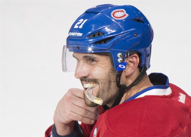 Montreal Canadiens\’ Brian Gionta celebrates after scoring against the New York Rangers during overtime NHL hockey action in Montreal, April 12, 2014.