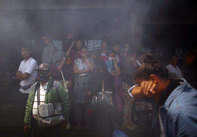Smoke rises from the cremation pyre of mountaineers, killed in an avalanche on Mount Everest, during a funeral ceremony in Katmandu, Nepal, Monday, April 21, 2014. 