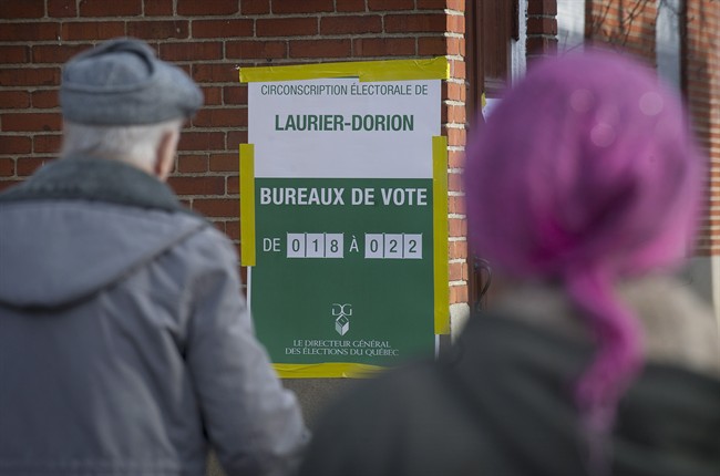 People lineup to vote at a polling station in Montreal Monday, April 7, 2014.