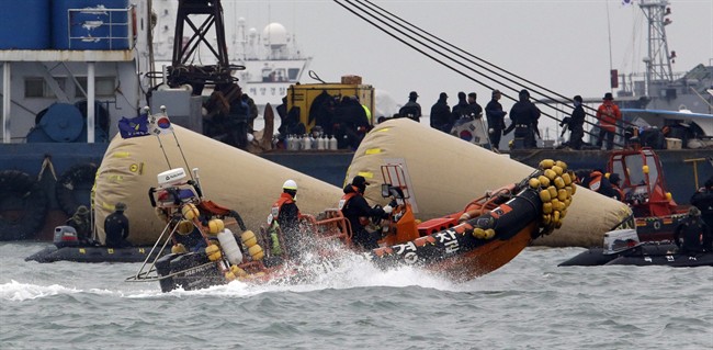 Searchers and divers look for people believed to have been trapped in the sunken ferry.