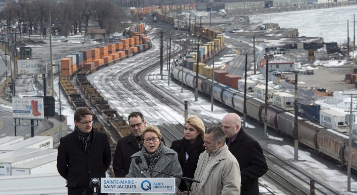 PQ Leader Pauline Marois holds a news conference on the rooftop of a building Wednesday, April 2, 2014 in Montreal.