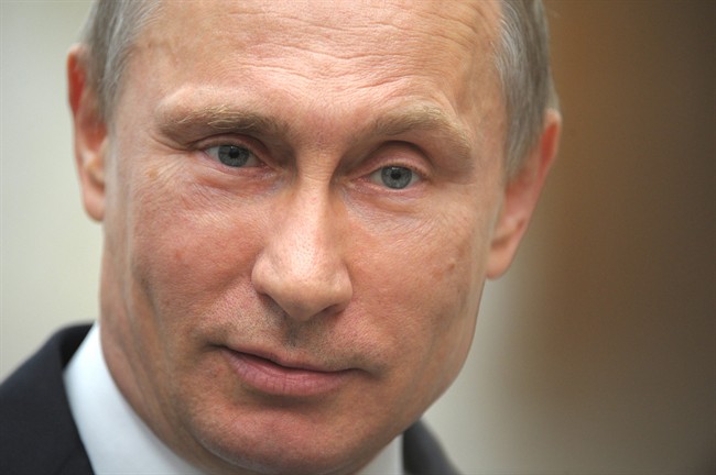 Russian President Vladimir Putin speaks to press after a meeting of the Eurasian Economic Council in Minsk, Belarus in this April, 2014 file photo.
